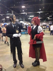 Mya at Anime West 2015, cosplaying as Grell Sutcliff from  Black Butler, with Sebastion Michaels from Black Butler